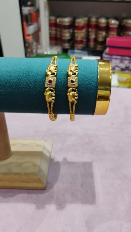 Elegant Gold Elephant Motif Bangles with Ruby Stone Accent
